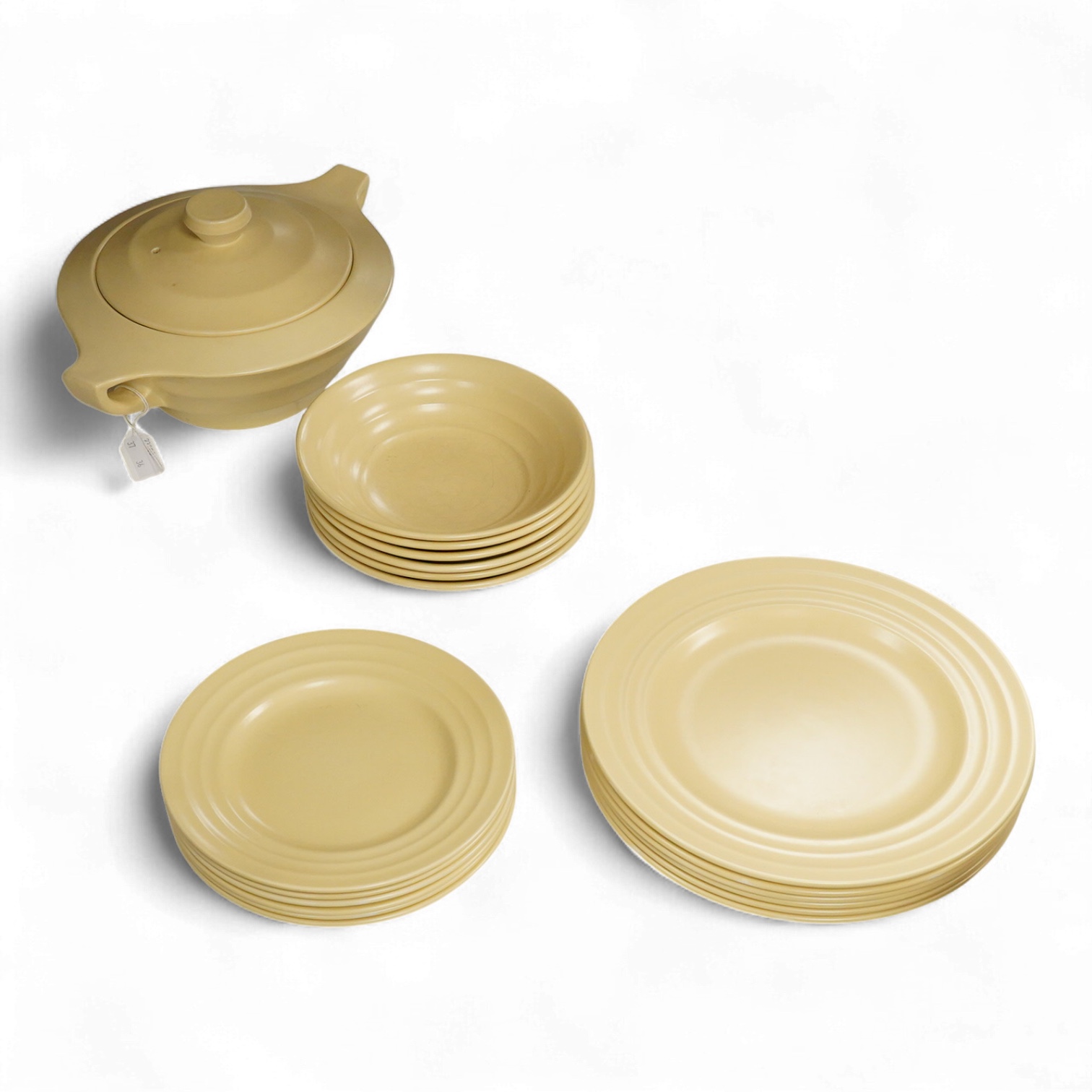 A part-set of Keith Murray Wedgwood dinnerware in matt straw, six-place setting including covered tureen (19)